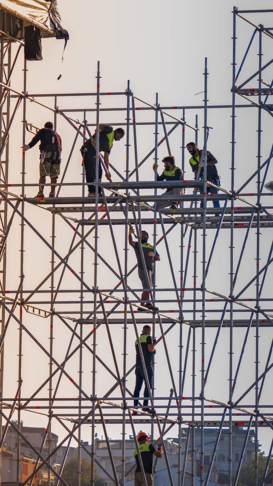 Workers on scaffolding during a facility construction project